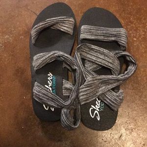 Gray and black sandals